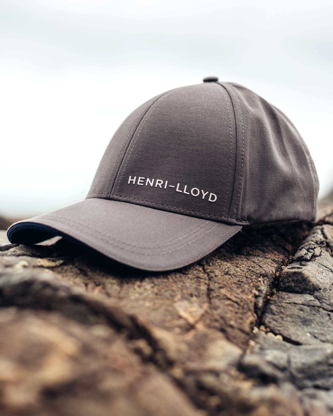 Unisex Reflective sandwhich peak Henri Lloyd Freedom Crew Cap Hat Corporate Slate Blue Embroidered logo to back 